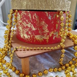 NWOT GOLD MARDI GRAS BEADS & BOX.